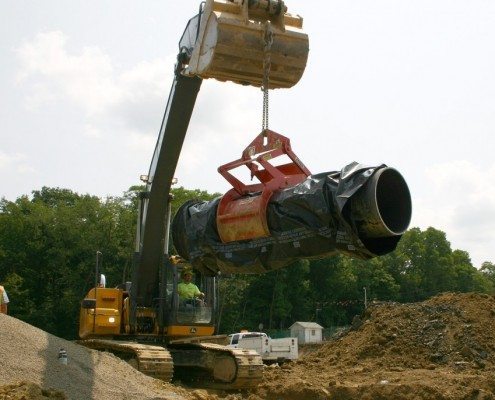 Wright Construction Lifting Wrapped Pipe