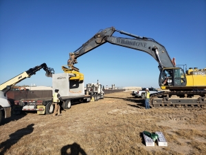 Removing culvert from trailer