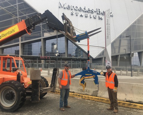 two stadium workers with Kenco lift by Mercedes Stadium