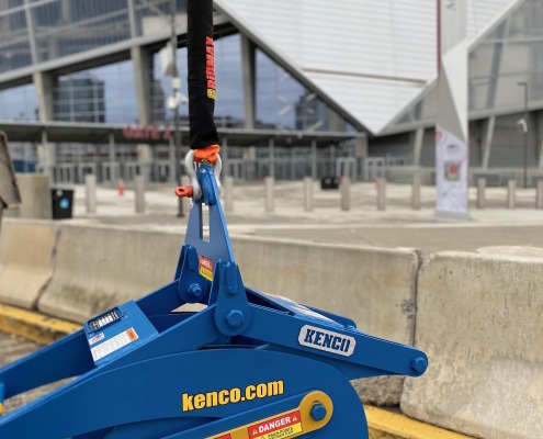 Blue Kenco Barrier Lift with alignment leg in front of Mercedes Stadium