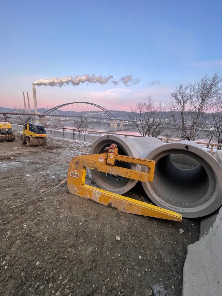 pipe hook near river at sunrise