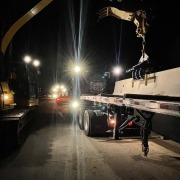barrier wall on flatbed truck at night