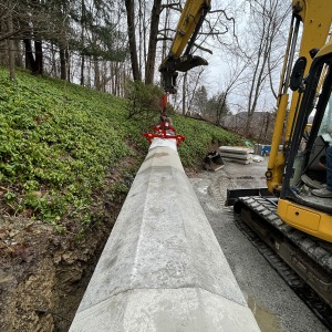 placing capstone piece on retaining wall with multilift