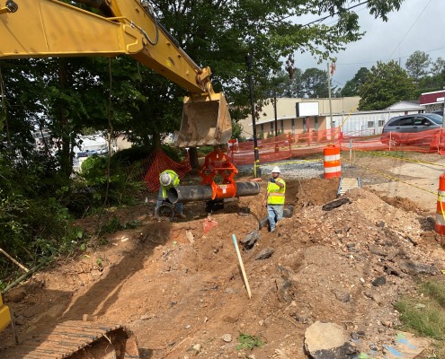 excavator reach over construction site