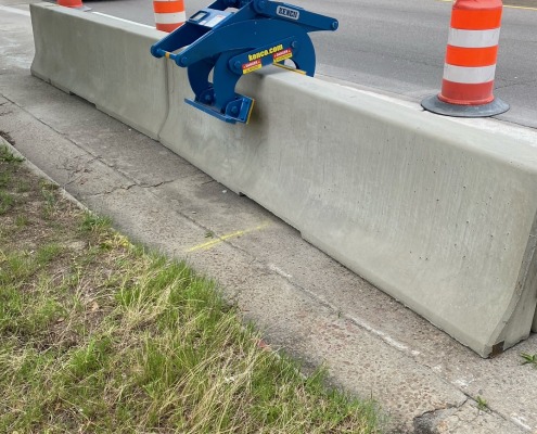 placing barrier wall along the side of roadway to guide traffic