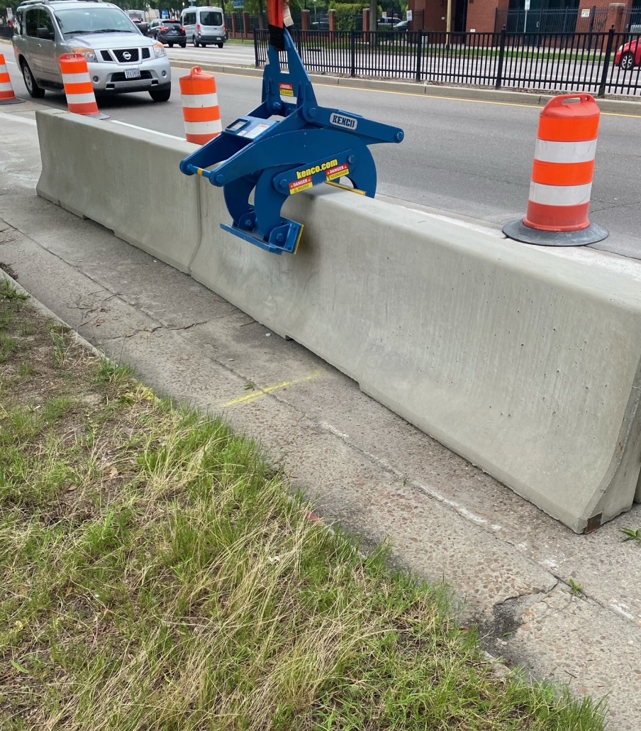 placing barrier wall along the side of roadway to guide traffic