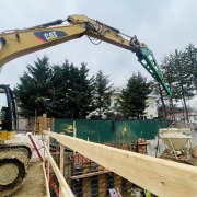 jib boom extension on excavator picking up cement mixer