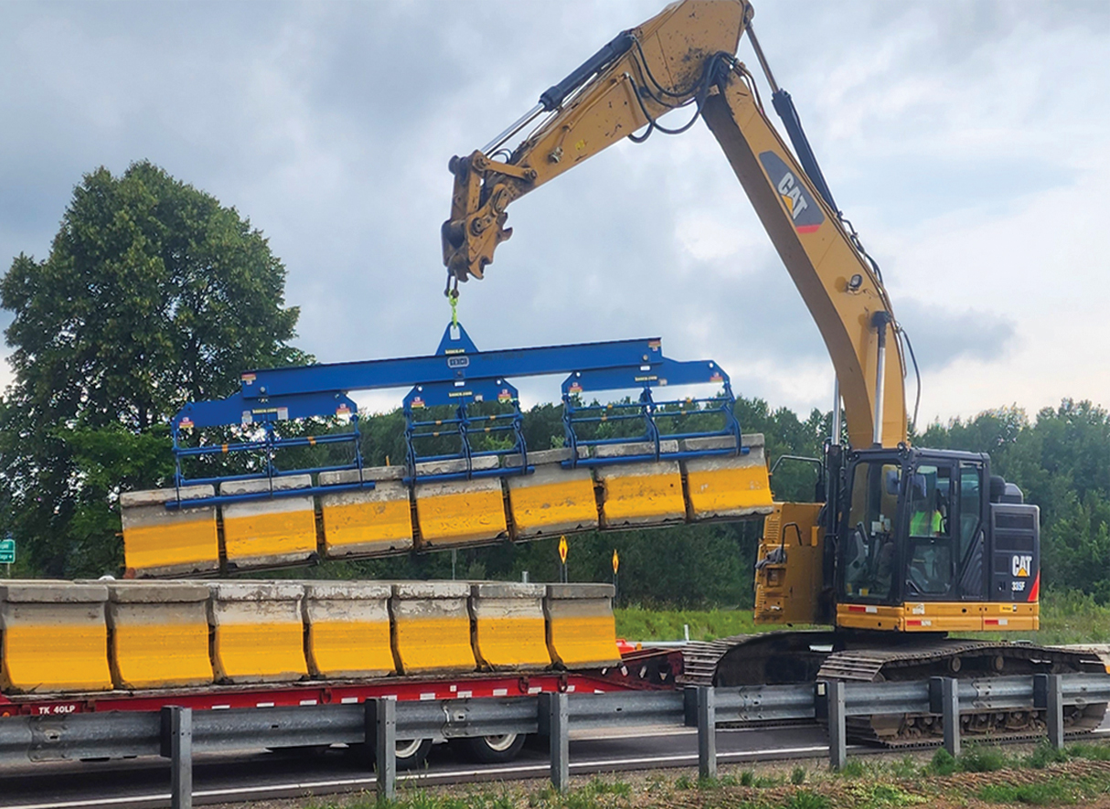 Zipper wall lifter picking up seven walls at one time to load onto a trailer