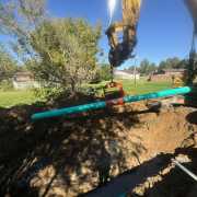 easiest method for installing pipe in trench with excavator