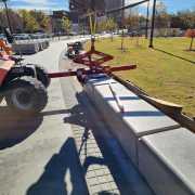 final setting of precast concrete benches in a row