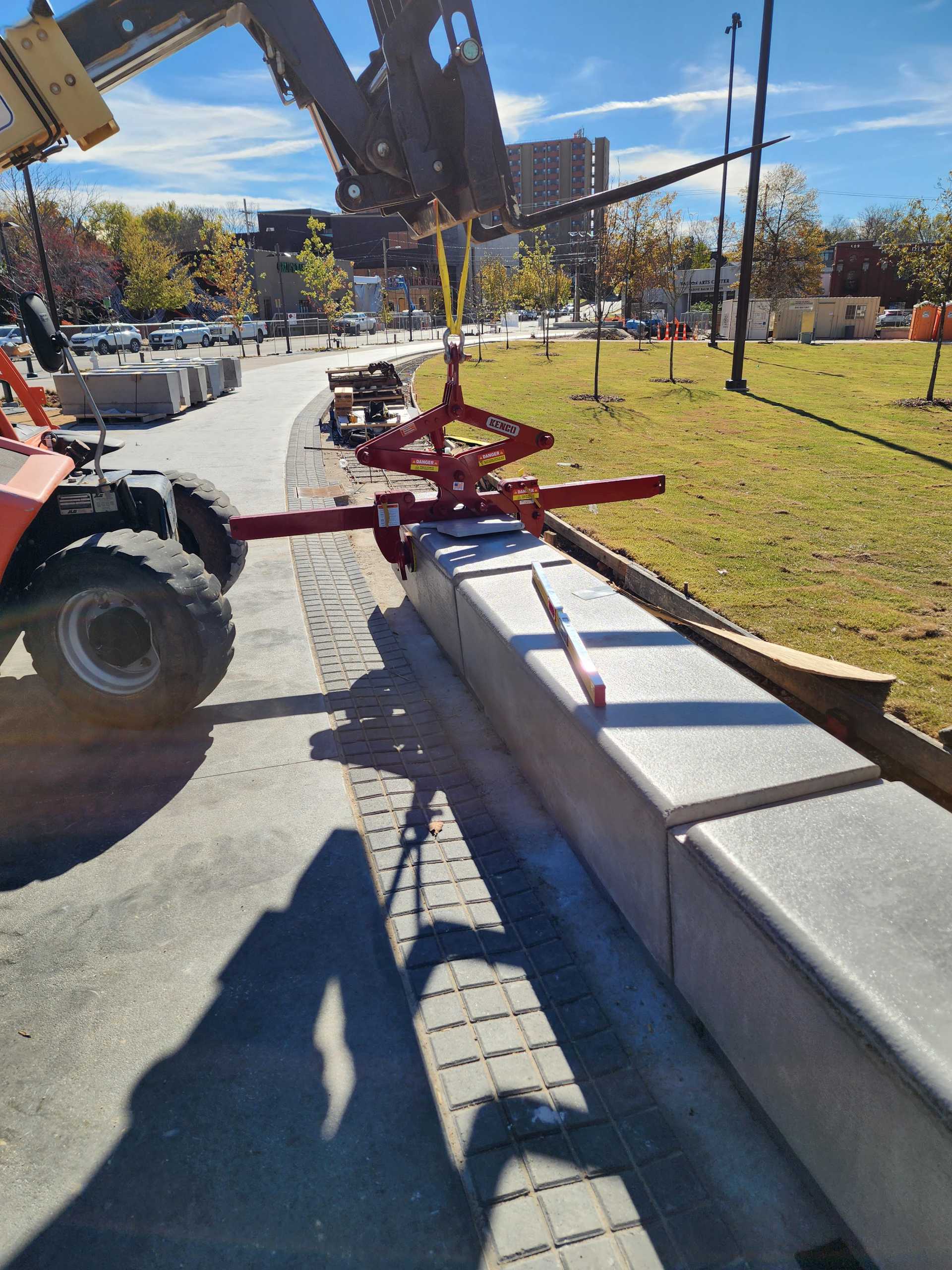 final setting of precast concrete benches in a row