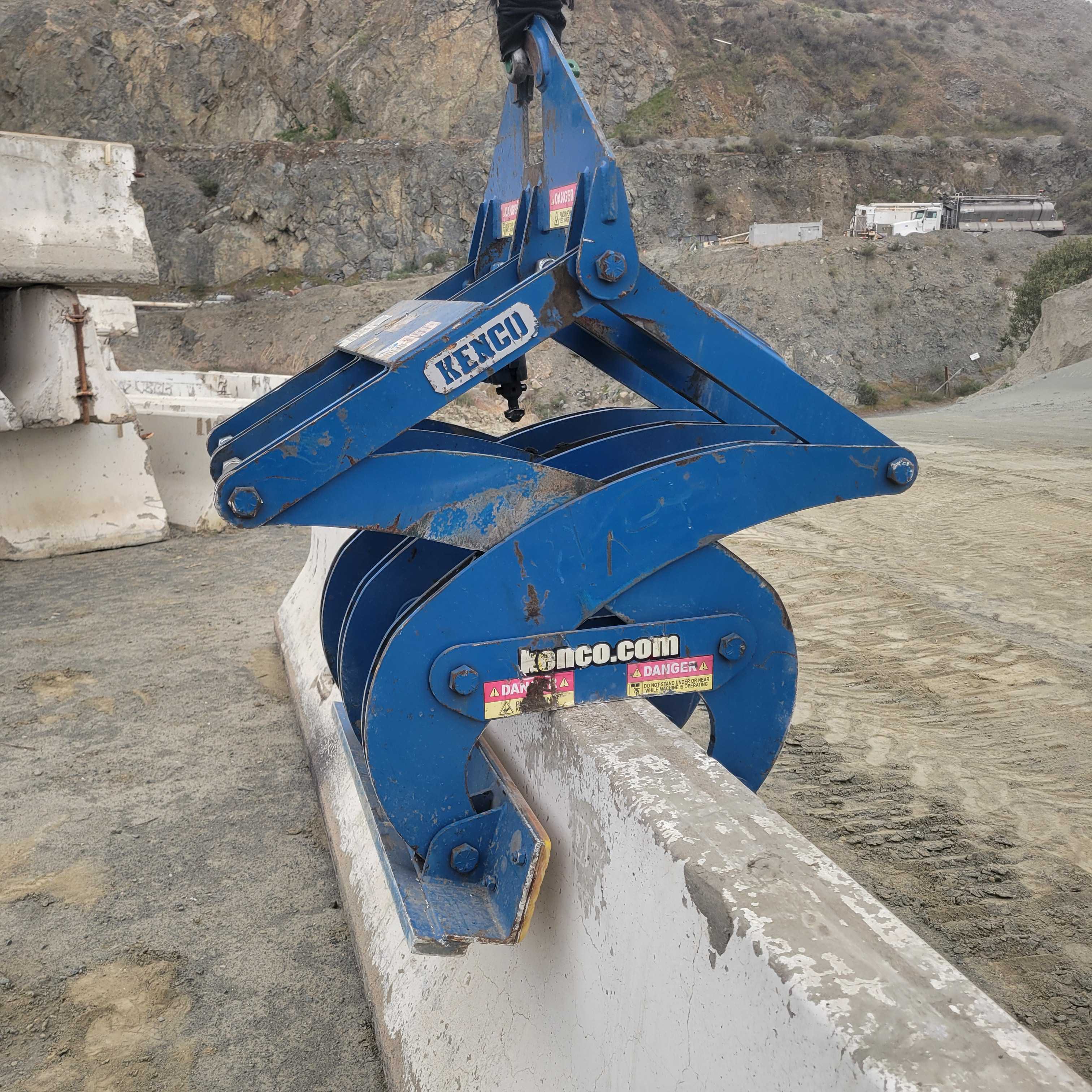 blue k rail grabbing device close up