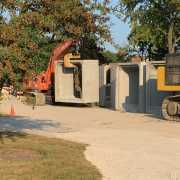 mid size excavator setting large box culverts with a yello pipe hook device