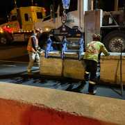nightime road construction site setting multiple concrete zipper wall